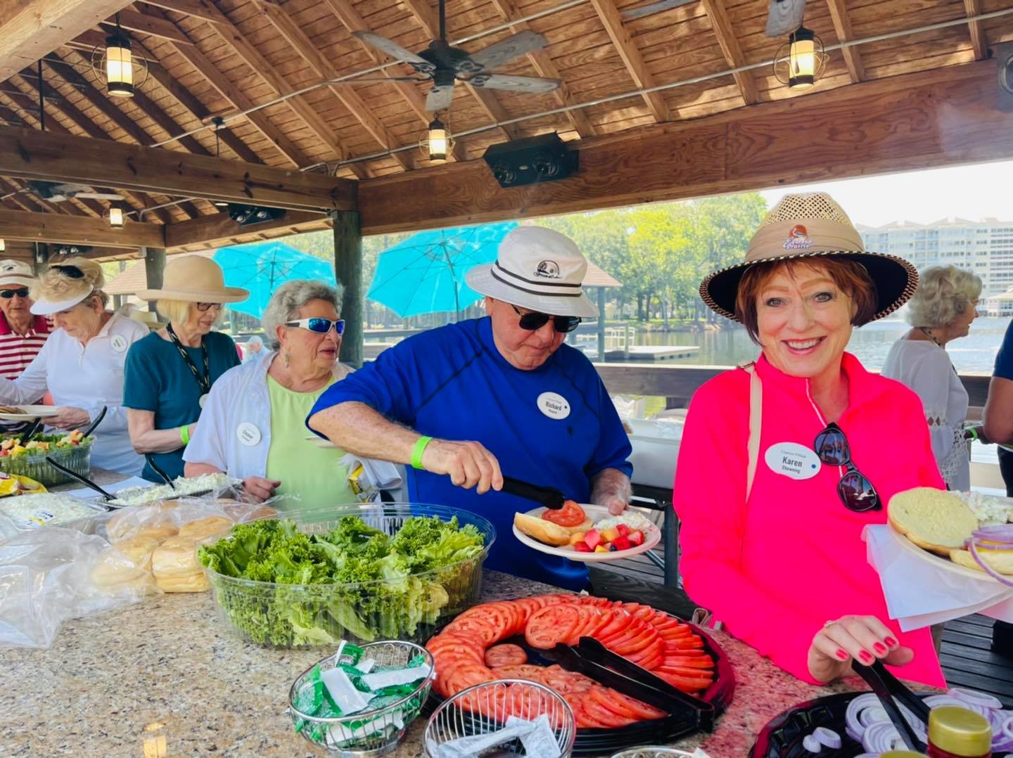 Cypress Village resident enjoy the cookout at the putting tournament.